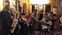 a group of people playing music in a restaurant